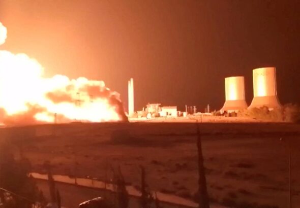 Flames rise at Tishreen thermal power plant following an explosion, near Otaybah